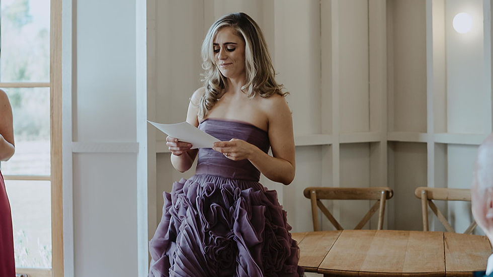 The groom's sister reading a poem during their wedding ceremony at Hyde House, Stow-on-the-Wold