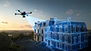 Modélisation 3D par drone d'un bâtiment historique au coucher du soleil.