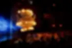 The chandelier ascending from the stage and over the audience toward the ceiling during the opening scene of the Broadway production of The Phantom of the Opera at the Majestic Theatre in New York City.