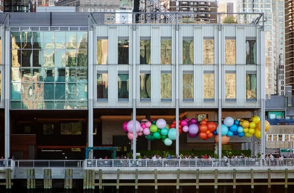 The balloon rainbow installation at South Street Seaport Pier 17 as seen from the East River.