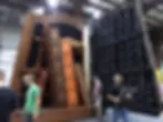 Hudson Scenic Studios fabricators and automation designers prepare to test the automation of scenery for Hong Kong Disneyland's live production, Mickey and the Wondrous Book, at their fabrication studio in Yonkers, New York.