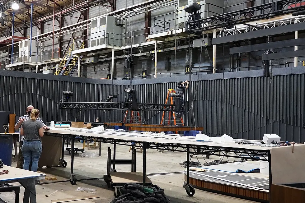 A curved wood slat wall painted black for the television studio set of Last Week Tonight with John Oliver, assembled at Hudson Scenic Studios' fabrication shop in Yonkers, New York.