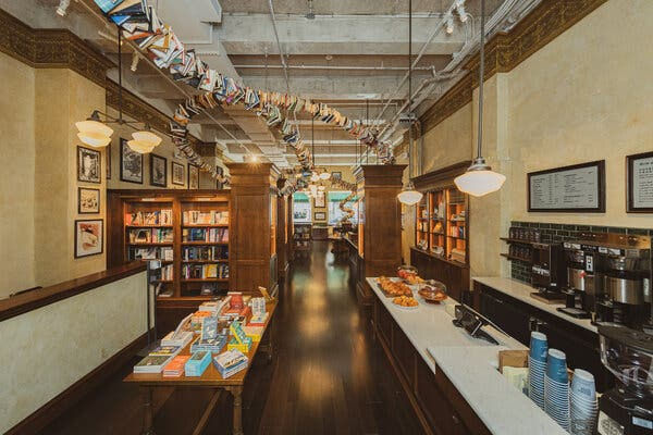 Comprised of thousands of books and nearly 140 feet long, the Bookworm sculpture winds throughout the Drama Book Shop and cafe, suspended from the ceiling.