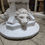 Thumbnail: Concrete pedestal pot stand white lion heads
