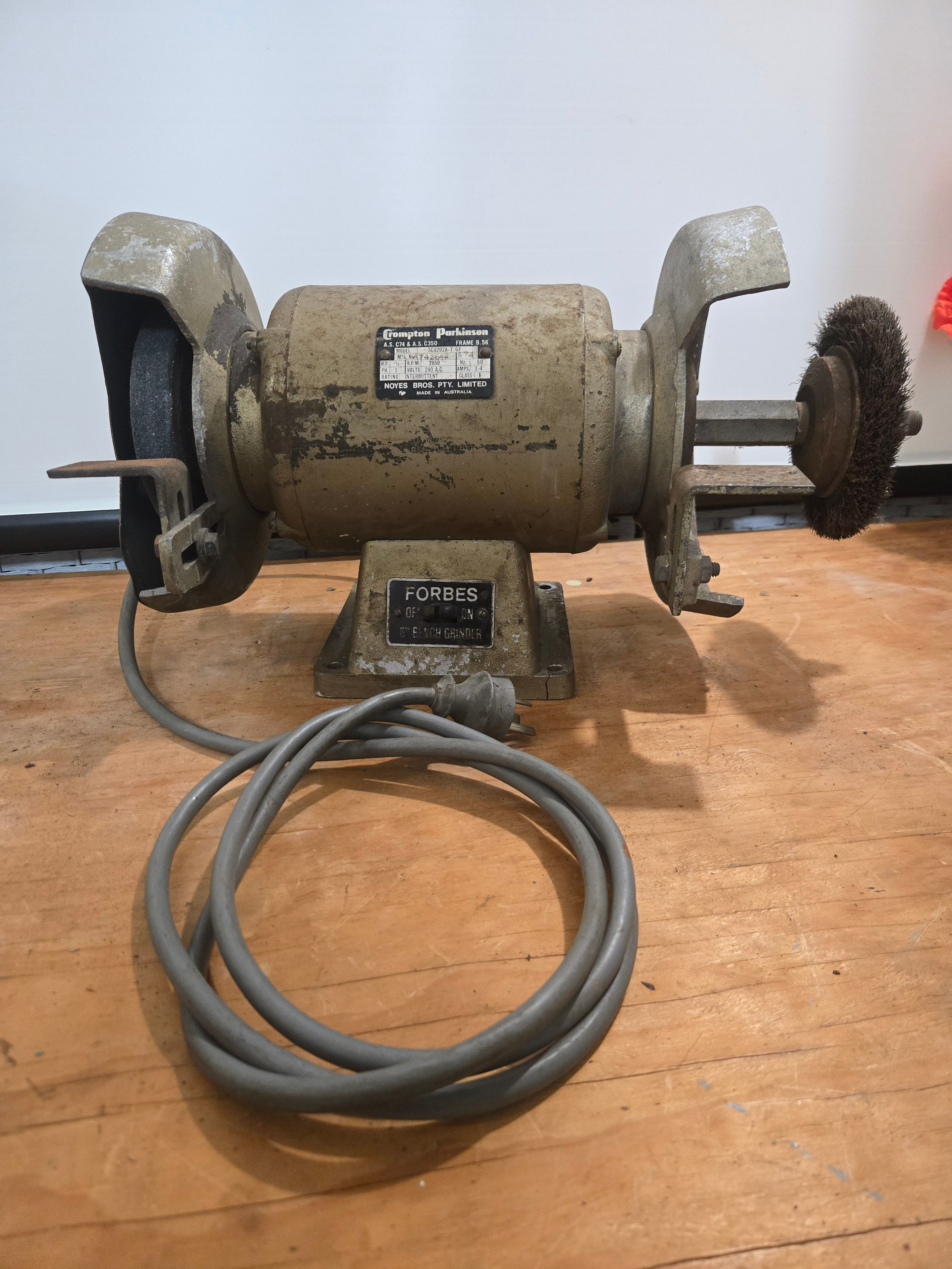 vintage 8-inch bench grinder manufactured by Crompton Parkinson tool
