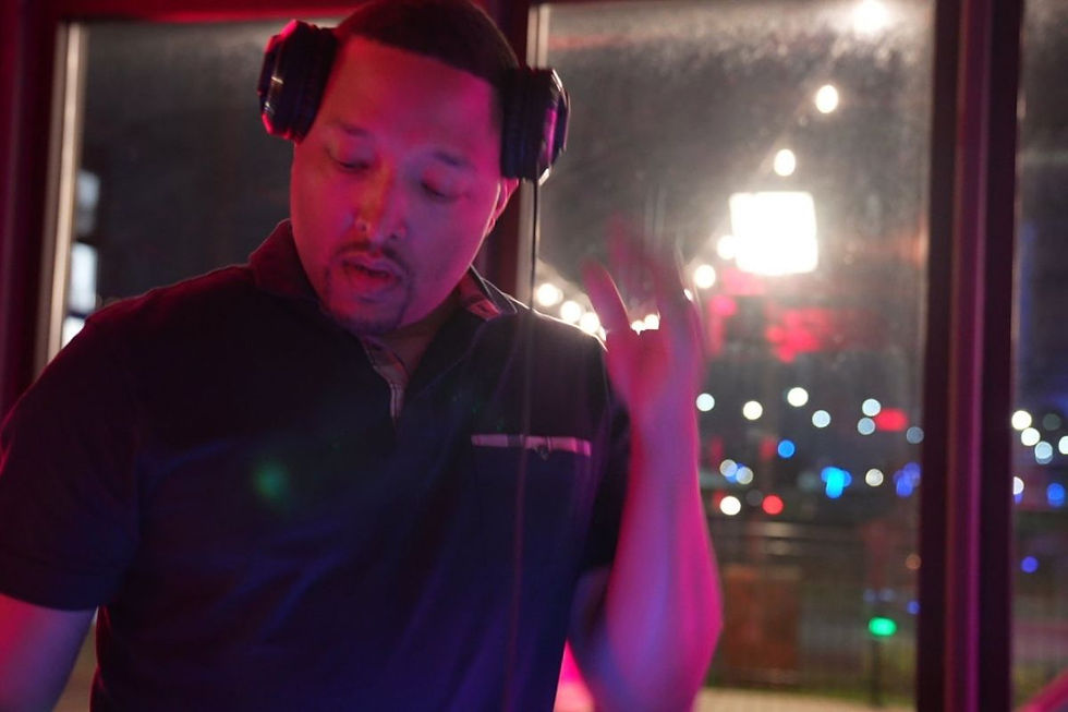 DJ Marty McFly entertaining guests in a DJ booth.