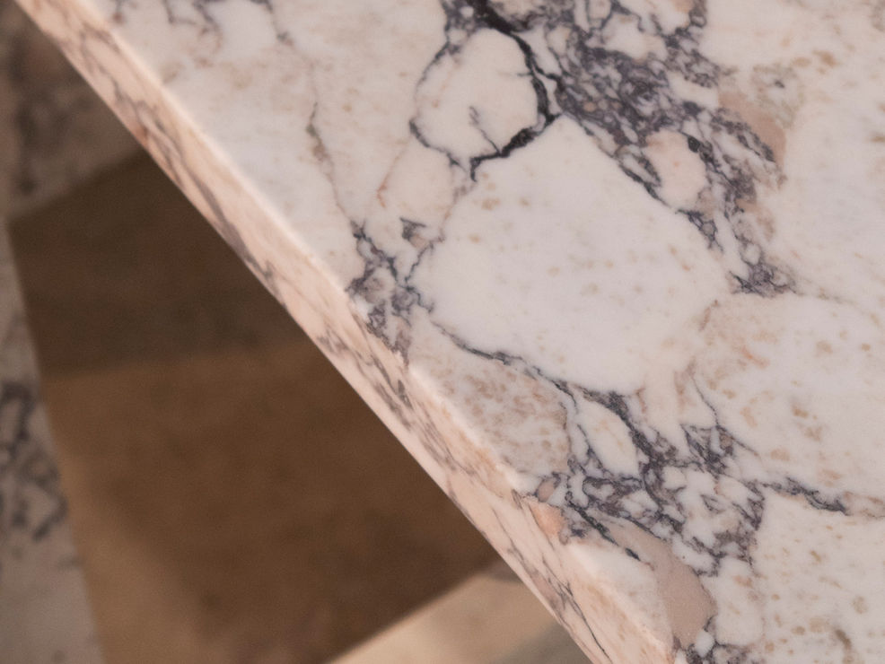 Cut and fold console made of Calaccatta macchia vecchia
