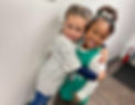 Elementary students hugging