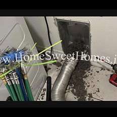 Technician performing laundry room exhaust vent cleaning to remove lint buildup in a New Jersey home