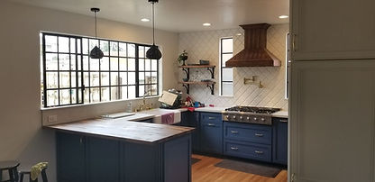 Kitchen remodel in San Diego with navy blue cabinets, wood countertops, custom tile backsplash, and copper range hood – H&M B