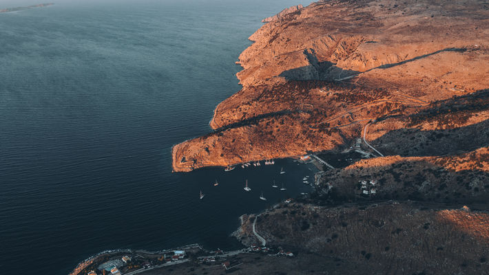 Natural bay with boats at sunset
