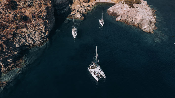 Bay with three sailing boats