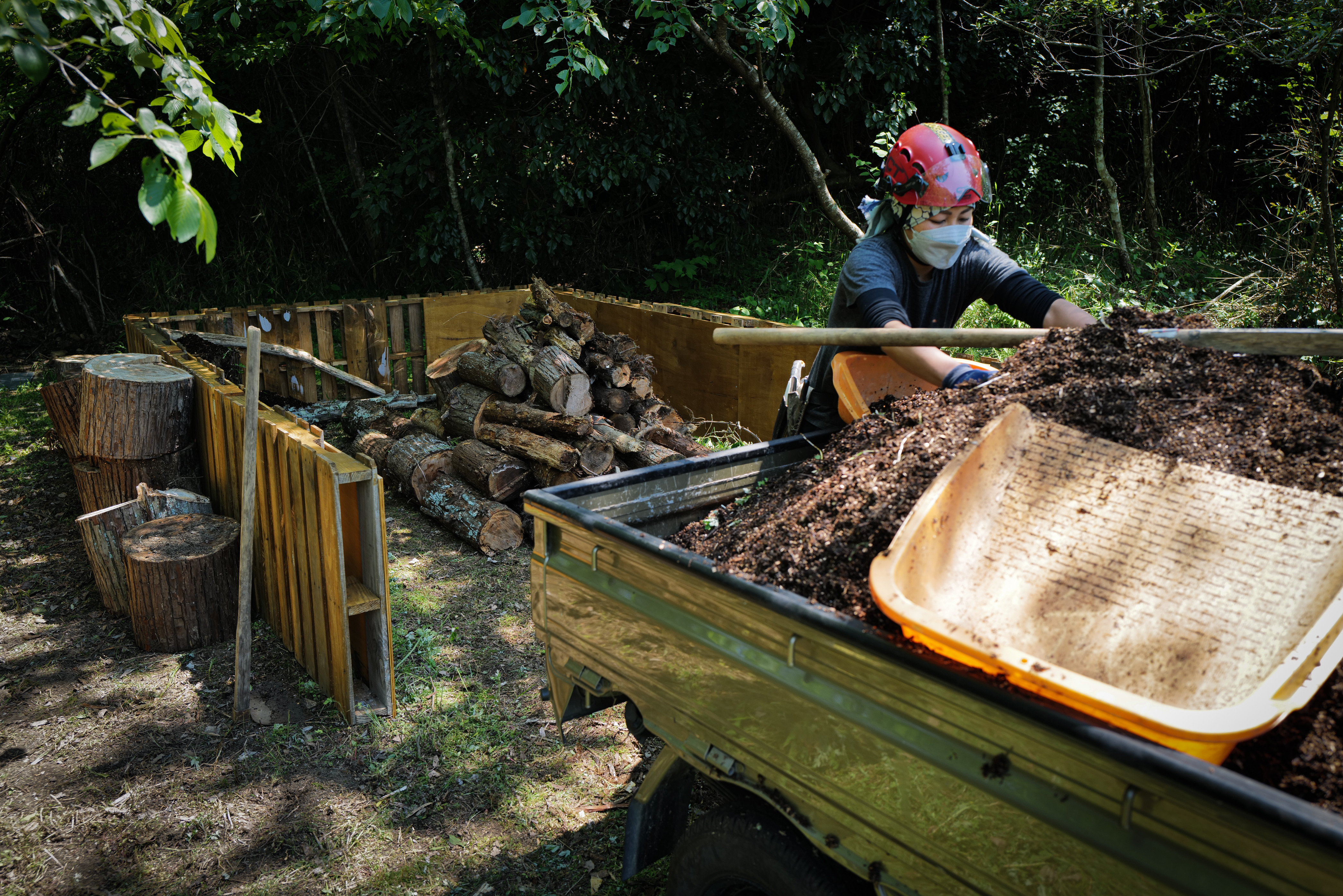 Eco-stack filled with tree branches and habitat materials — Sentei-ya Sora, Mie
