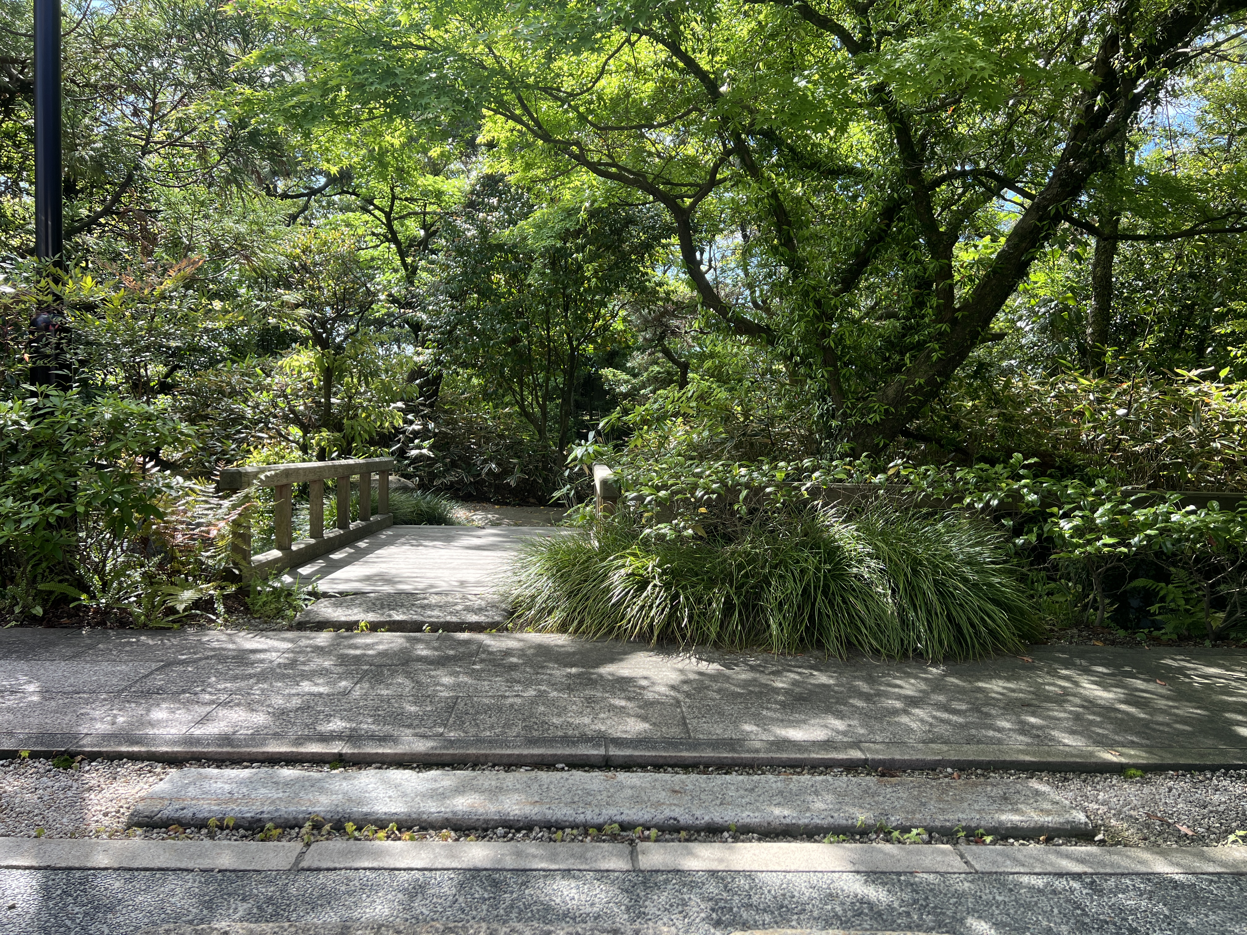 Stone lantern and moss in the Japanese garden at Onoebessou, Yokkaichi City
