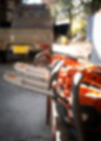 Battery-powered husk burner chainsaw installed.