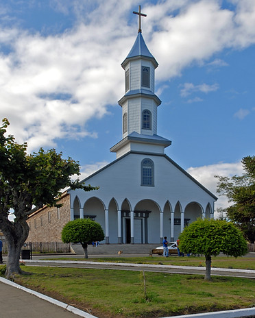 vertical-shot-church-with-blue-cloudy-sky-background.jpg