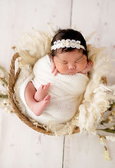 Newborn baby wrapped and posed during a photo session in Crown Point, IN