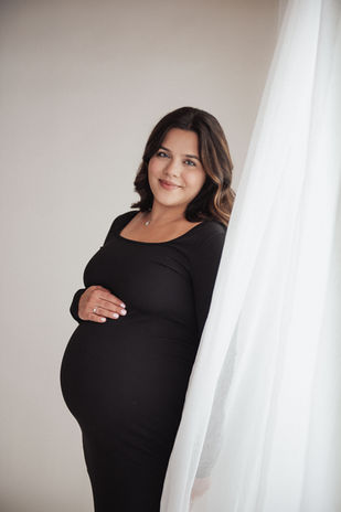 Expectant mother posing during a studio maternity session in Northwest Indiana.