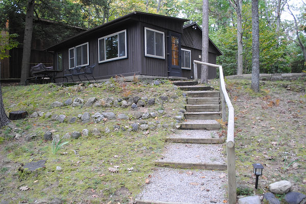 Lakefront cabin exterior with stairs