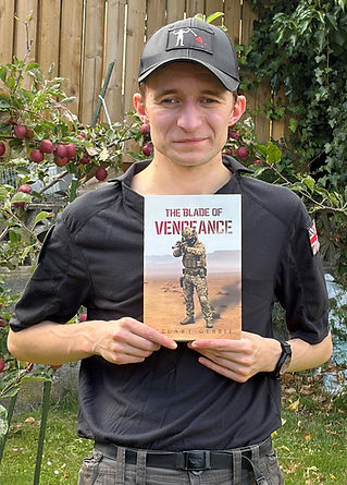 Photo of author Stuart Gebbie in a cap holding his debut novel "The Blade of Vengeance".