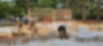 Carpenters framing a new house on a concrete foundation