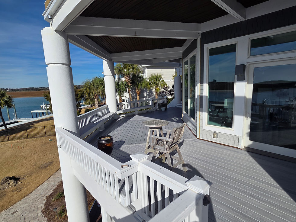 Modern grey composite deck with white railings and columns