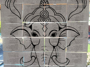 Cards hung on a window. Collectively the cards make an image of Ganesha. The backs of the cards contain weekly to-do lists