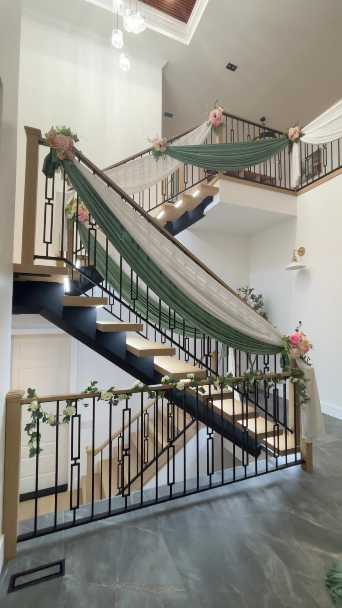Full staircase styled in sage, ivory and soft florals
