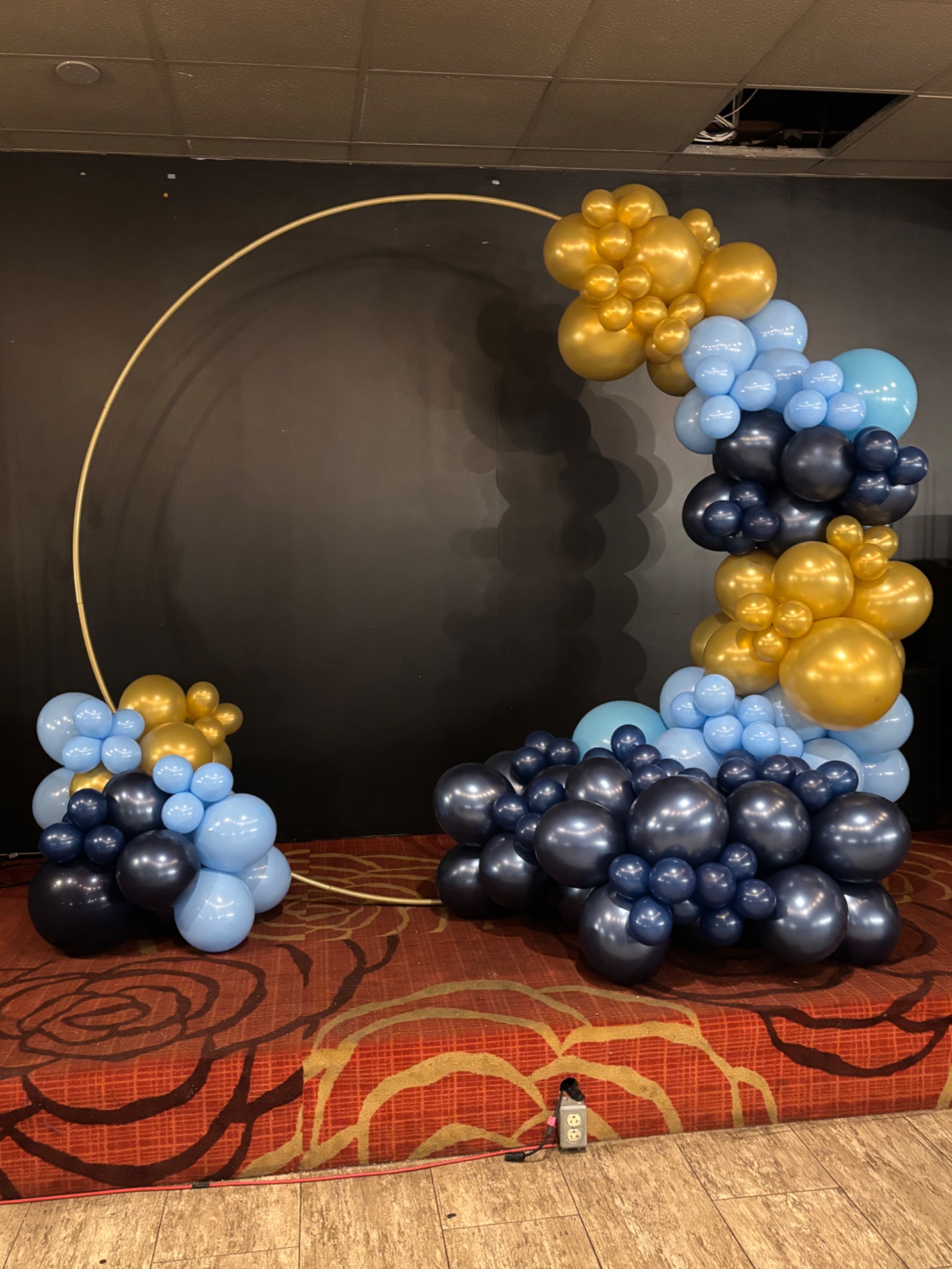 Blue, navy and gold balloon hoop display