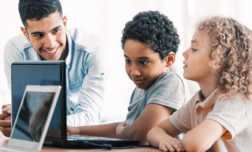 Smart boys and teacher during computer p