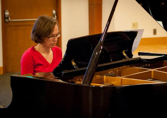 Adult piano student of Stephanie Emery playing piano in West Seattle