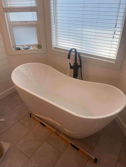 drop in bathtub with standing tap