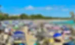 Many beach goers rely on their cabanas for shade and security