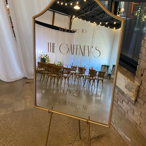 simple gold rim mirror available for rent north shore ma