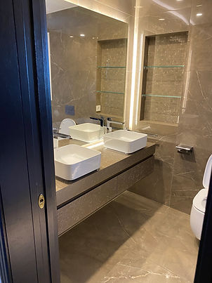 Bespoke bathroom installation, double sink unit and large mirror - Alchemy Interiors.
