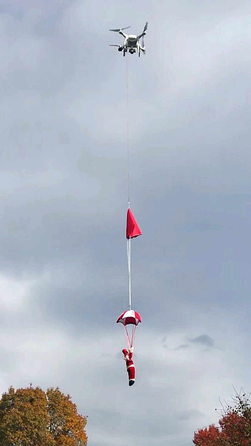 Thumbnail: DJI Phantom 3 carries a Santa Clause using the Drone Sky Hook device and drops it over the field during Christmas.