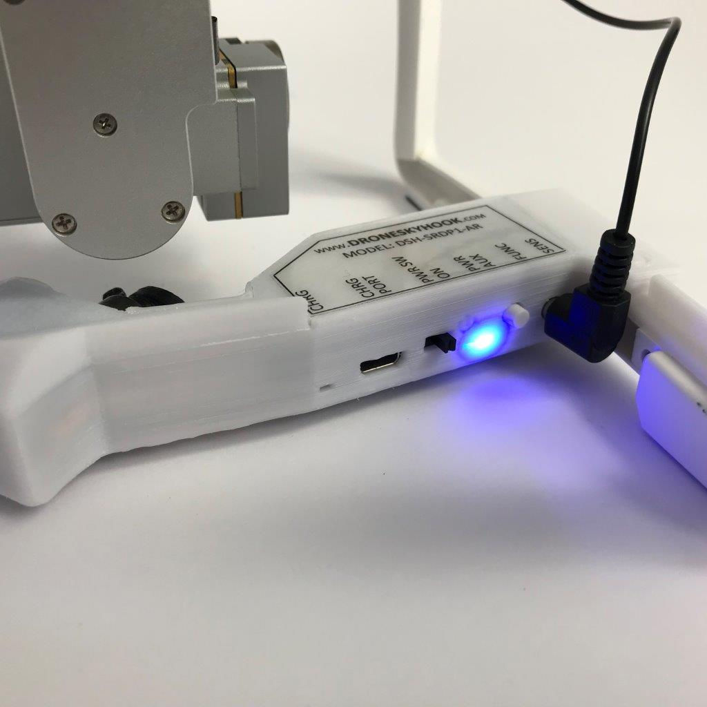 Drone Sky Hook PLUS device on DJI Phantom 3, showcasing innovation for public safety and industrial drone applications.