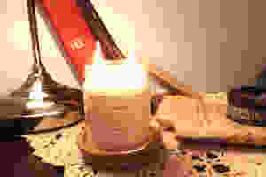 cinnamon vanilla candle with books