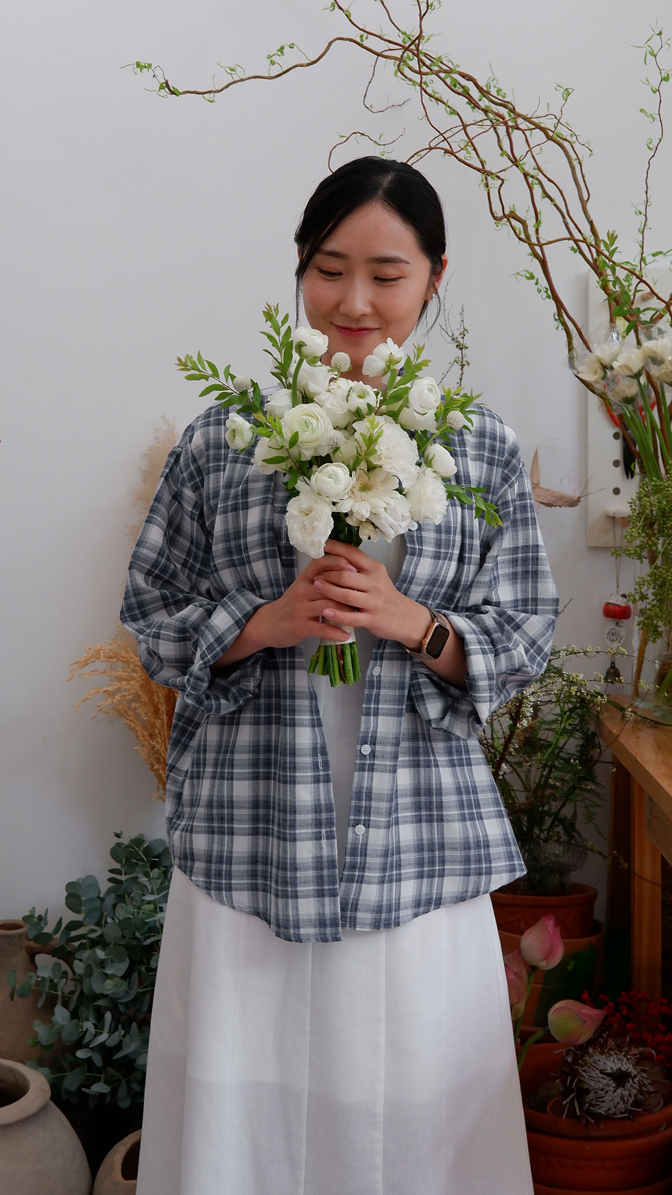 SeoHee holding the bridal bouquet she created for her future wedding during a private flower workshop at Flor Saigon.