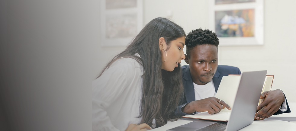 A woman and a man using a computer to learn life skills