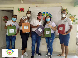 Volunteers Lifting Construction Frame