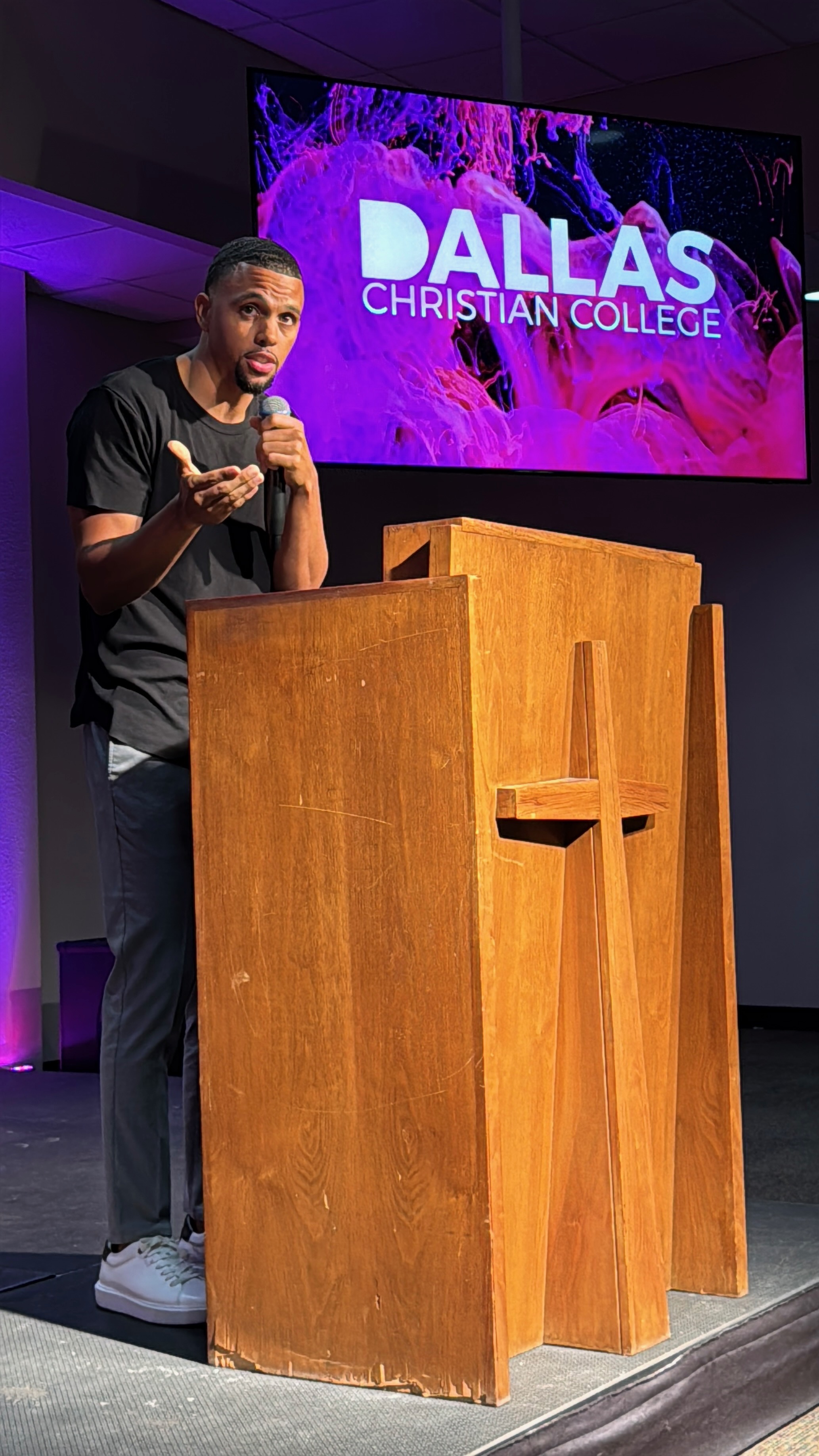 Tyler Patmon speaking at a podium