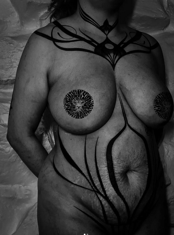 Black and white photo of body art