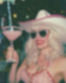 a person in a cowboy hat, red lipstick, looking fabulous and doing the most