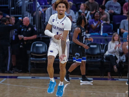 Kezza Giffa celebrating HPU men's basketball win.
