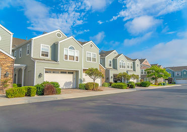 Duplex houses with green wood vinyl sidings