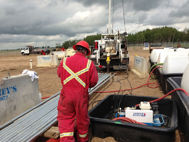 A worker testing a water well