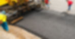 Asphalt spreader in work on site