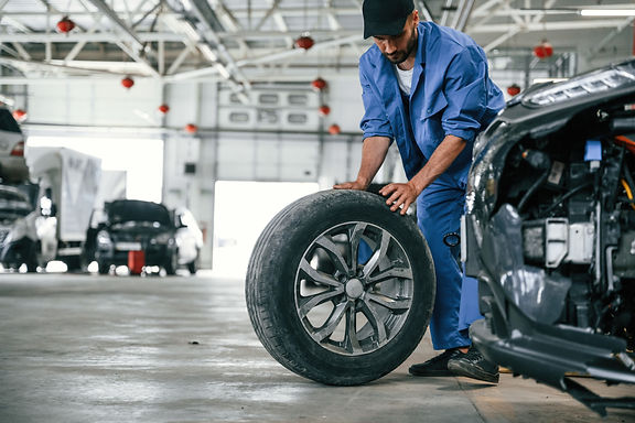 Auto mechanic working in garage