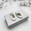Miniatura: Aretes doble ovalo cartoneado elegante